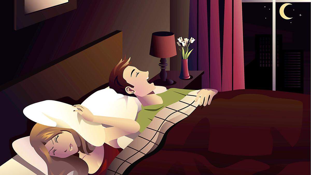 Snoring husband in the bedroom keeps his spouse awake.