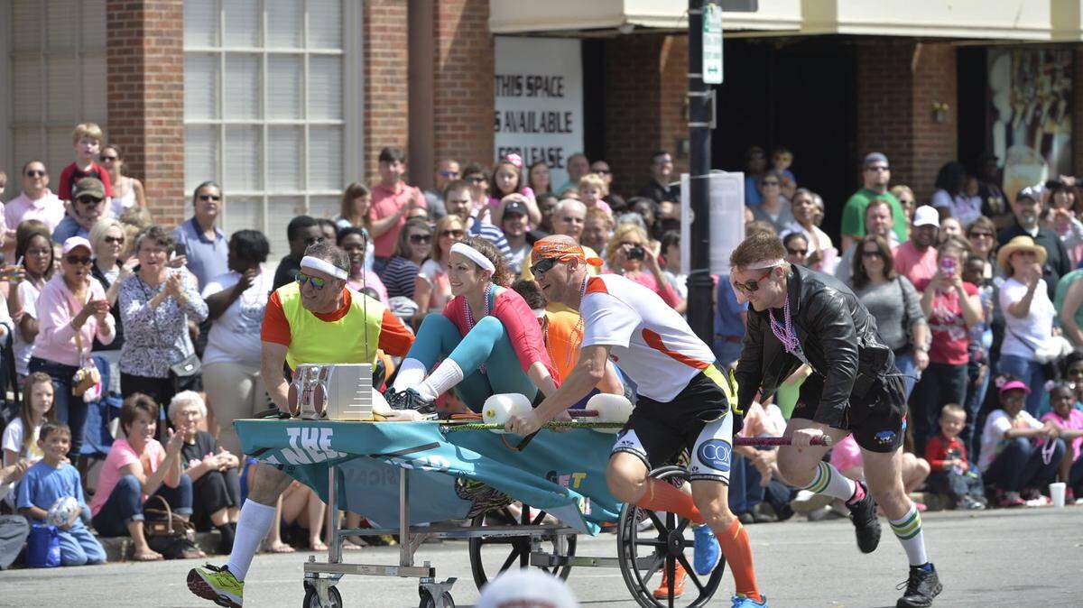 BEAU CABELL/THE TELEGRAPHWatch teams of all levels race decorated beds down Cherry Street on March 26 at the Cherry Blossom Festival Bed Race.