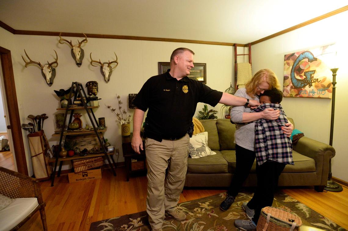 BEAU CABELL/THE TELEGRAPH Macon, Ga., 01/03/2019: Matt and Jennifer Giegler embrace their youngest son, Chris, right.