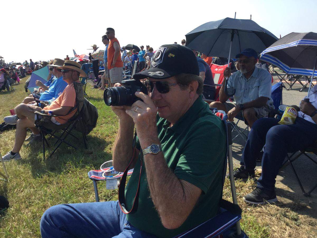 James Savage, a retired truck driver from Sparta, takes a photo during the Thunder Over Georgia Air Show at Robins Air Force Base on Saturday, the first day of the two-day show. “It’s amazing the air power that we have - just to see it,” said Savage, who came out to watch The Thunderbirds perform and to see the “old war birds.”
