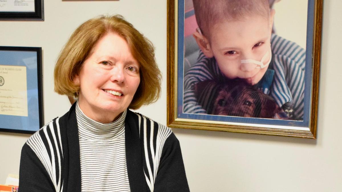 Dianna Glymph is pictured in her office at Big Brothers/Big Sisters of the Heart of Georgia. She has a photo on the wall of her son, Jordan, who died of cancer when he was 5 years old.