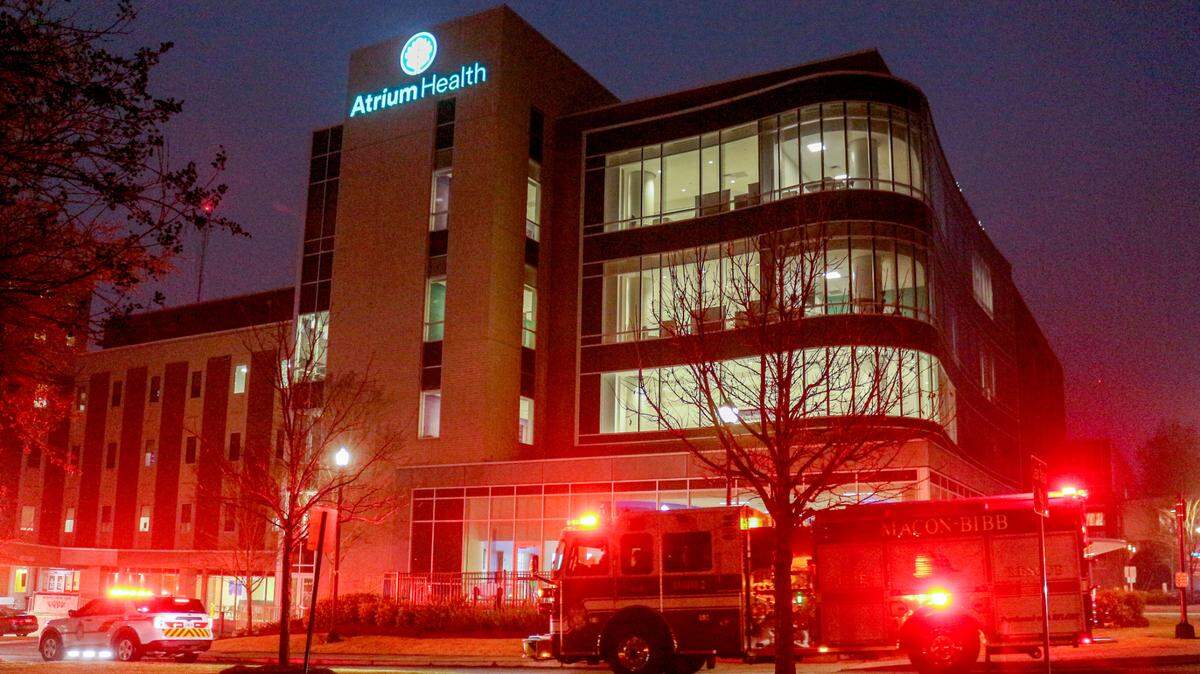 First responders drive around Atrium Health Navicent The Medical Center to honor health care workers with a “Parade of Lights” in observance of the two-year anniversary of the World Health Organization designating COVID-19 as a pandemic on March 11, 2020.