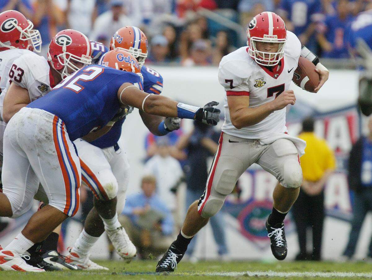 Quarterback Matthew Stafford slips past Florida defensive tackle Bobby Kane in this Telegraph file photo. Stafford is captaining the Rams in Sunday’s Super Bowl against the Bengals.