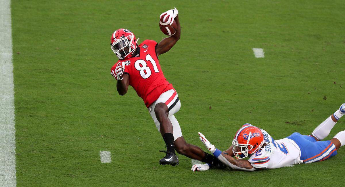 Georgia wide receiver Marcus Rosemy-Jacksaint (81) falls toward the goal line on a touchdown reception against Florida during the first half of a NCAA college football, Saturday, Nov. 7, 2020, in Jacksonville, Fla. Rosemy-Jacksaint was injured on the play.