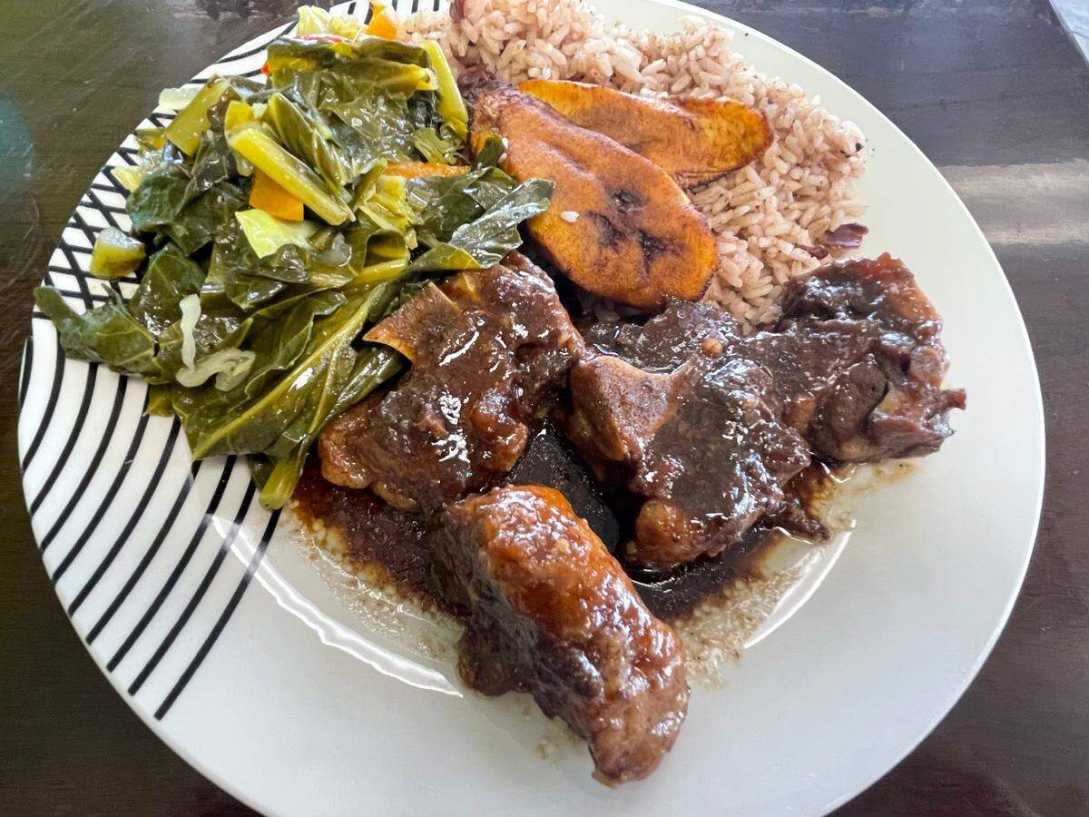 Oxtails with collard greens, brown rice and plantains at Crooklyn Roots in Byron.