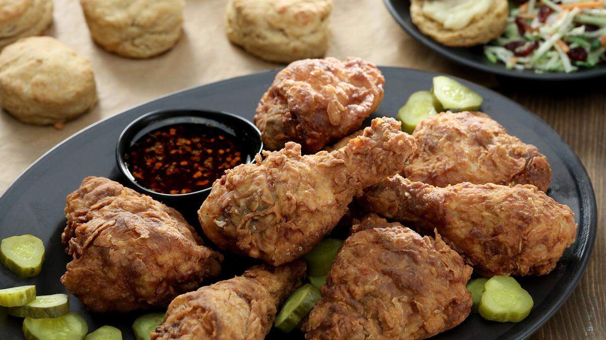 Smoked cheddar and sweet potato biscuits are great companions to fried chicken. A spicy dipping sauce sweetened with agave syrup and flavored with hot sauce and red pepper flakes delivers the heat.