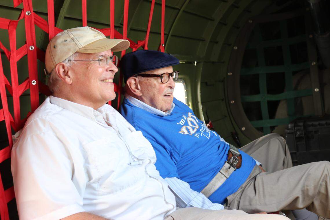 Crawford Hicks, right, and his son, Rob, fly on a B-17 over Atlanta on Saturday. Hicks was a B-17 pilot in World War II and was taken prisoner after getting shot down.