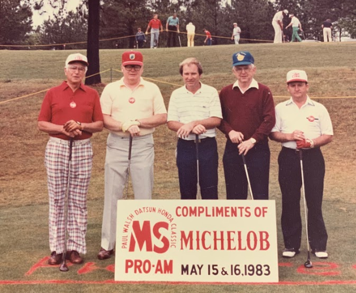 Buddy Dean on the far right, stands with a group of friends at a local golf tournament in 1983.