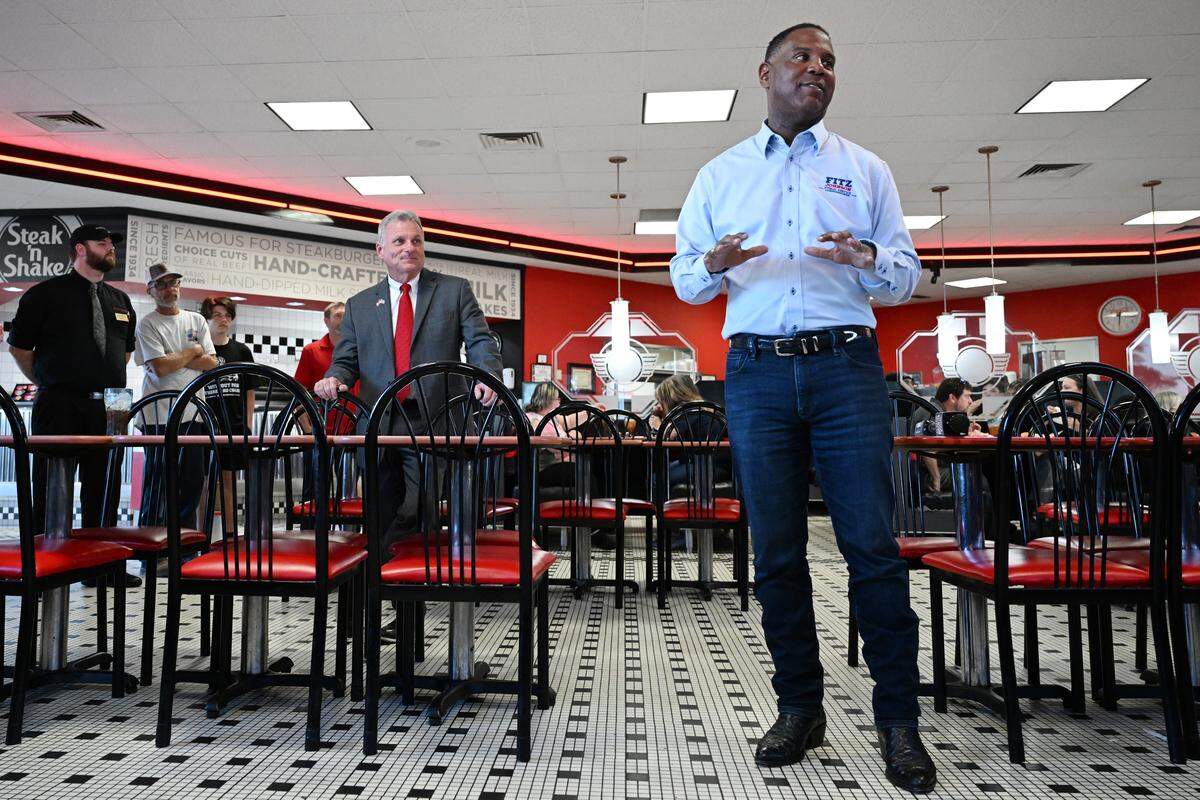 Georgia Public Service Commissioner Fitz Johnson (right) speaks at a campaign stop with Georgia U.S. Representative Buddy Carter (left) at Steak and Shake in Warner Robins, Georgia. Johnson is running for reelection to the Georgia Public Service Commission in a special election this November.