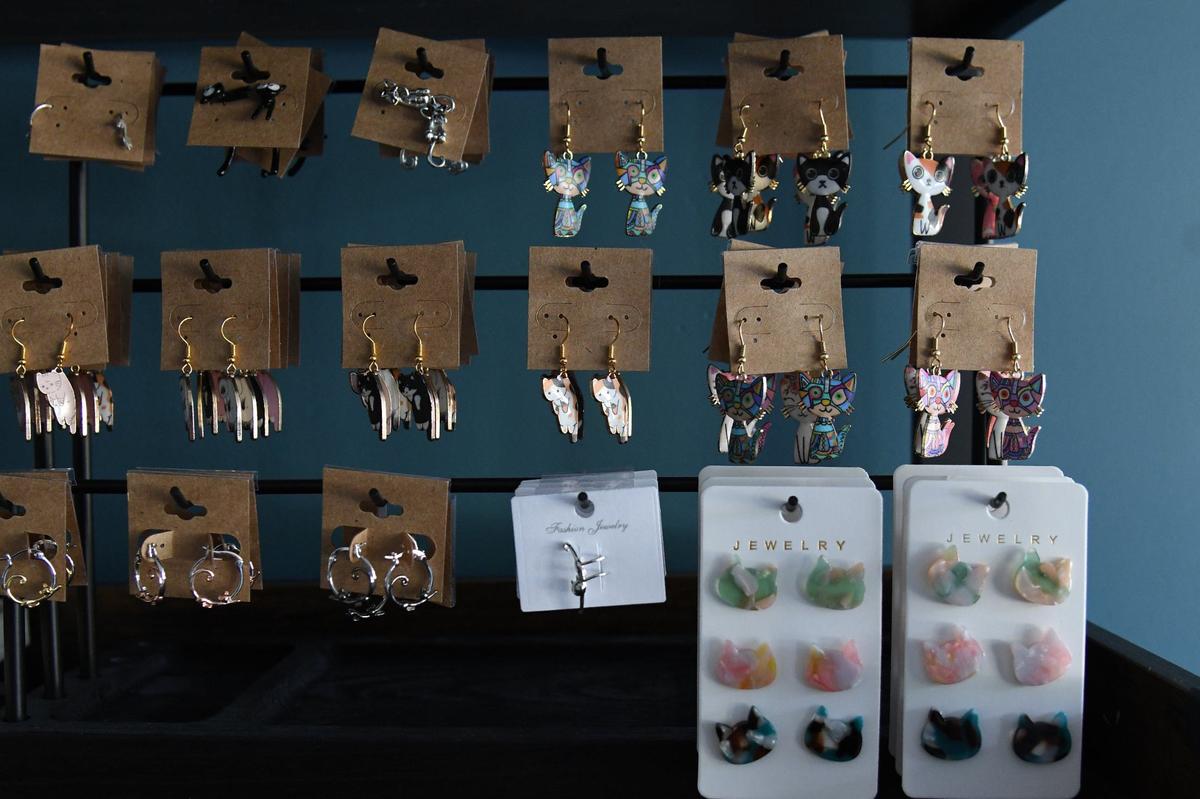 Cat jewelry sits in the retail space of Paws Awhile Cat Cafe on Thursday, July 11, 2024, in Perry, Georgia. The new cat cafe plans to open this summer and will partner with the Humane Society of Houston County and other rescue groups to have adoptable cats in the cafe.