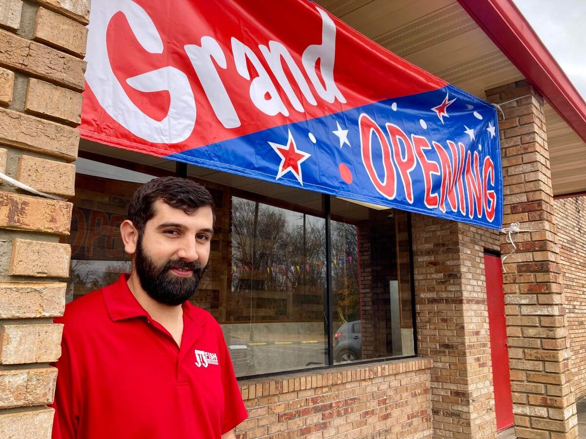 Hamza Awawdeh, left, manager at JJ Fish & Chicken that just opened at 4251 Pio Nono Ave. in Macon.