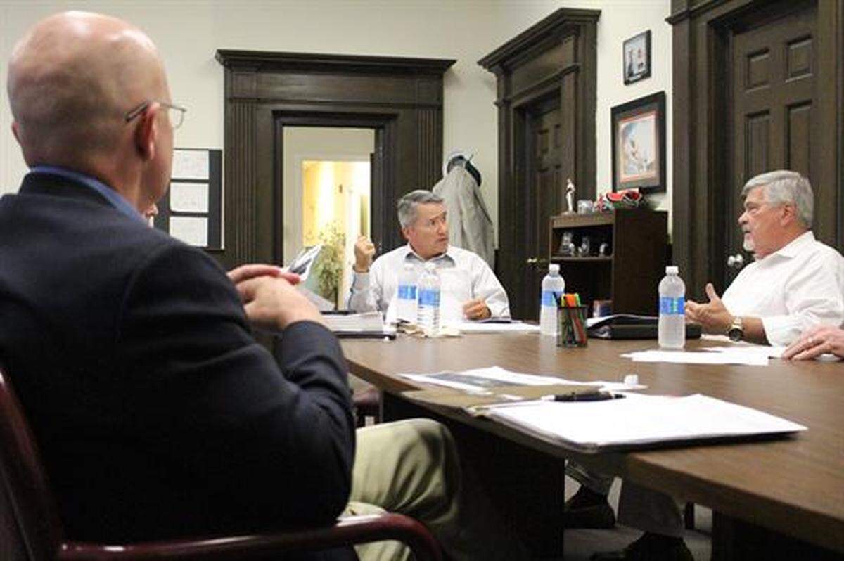 Dr. Carlo Musso (back to camera) meets with Congressman Jody Hice (center) about his work with CorrectLife in Milledgeville.