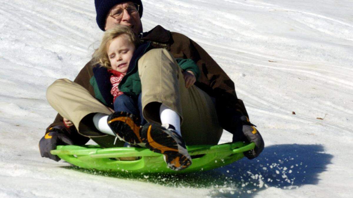 File photo: Tom Smothers slide with his grand daughter Sophie Smothers at Snow Day.