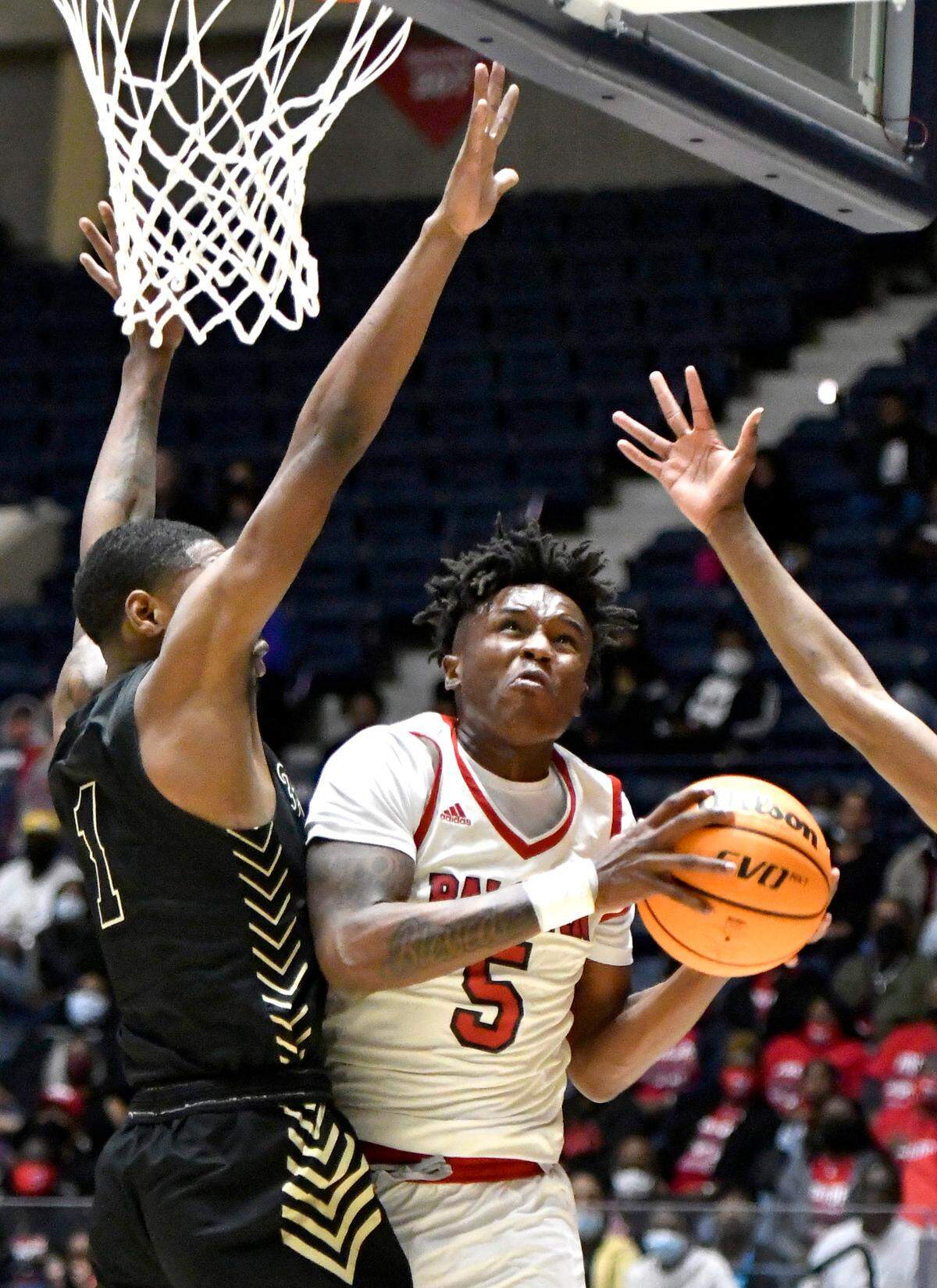 BaldwinÕs Jermyus Simmons (5) goes up for a shot during the BravesÕ GHSA 4A State Championship game against Fayette County Wednesday night in Macon.