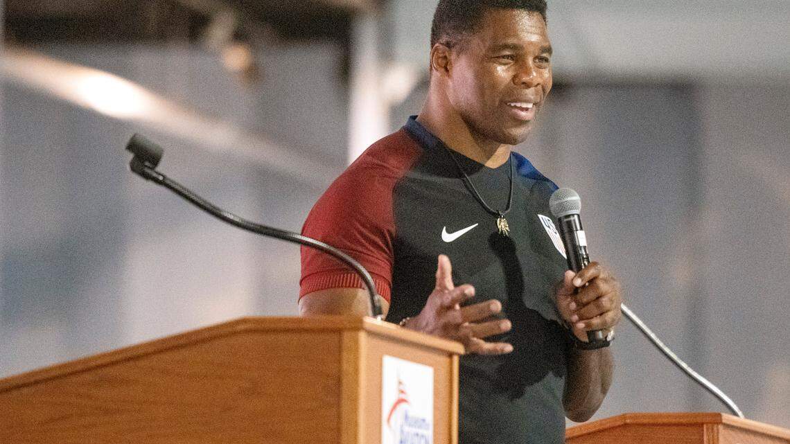 Former Heisman Trophy winner Herschel Walker speaks at the Museum of Aviation in Warner Robins on Wednesday as a part of an anti-suicide campaign at Robins Air Force Base.