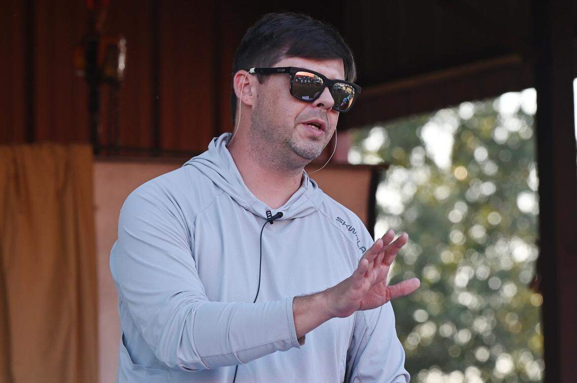 Altamaha Riverkeeper Executive Director Fletcher Sams speaks to Twiggs County residents on Sept. 16, in Dry Branch, Georgia, ahead of the Twiggs County Board of Commissioners meeting. Sams shared the speech he was planning to give during public comment at the meeting and shared information with residents.