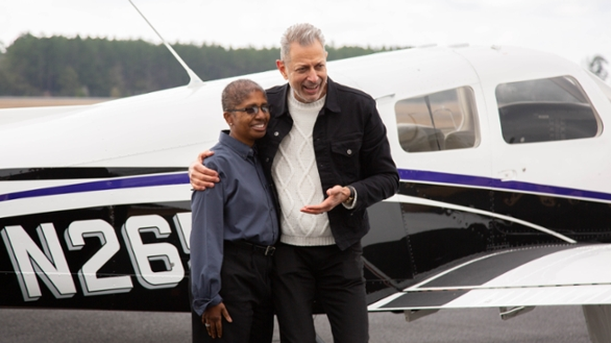 Actor Jeff Goldblum with Lisa Henry, who at the time of filming was program coordinator of MGA’s Air Traffic Management department. Henry, who passed away in August, is featured prominently in the episode and is memorialized with a special title card at the end of the program.