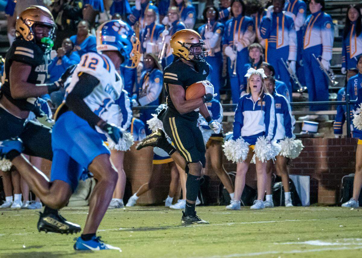 Senior Jacobi Jones (24) notches a pick six for Mary Persons against Crisp County in the second round of the GHSA Class AAA football playoffs.