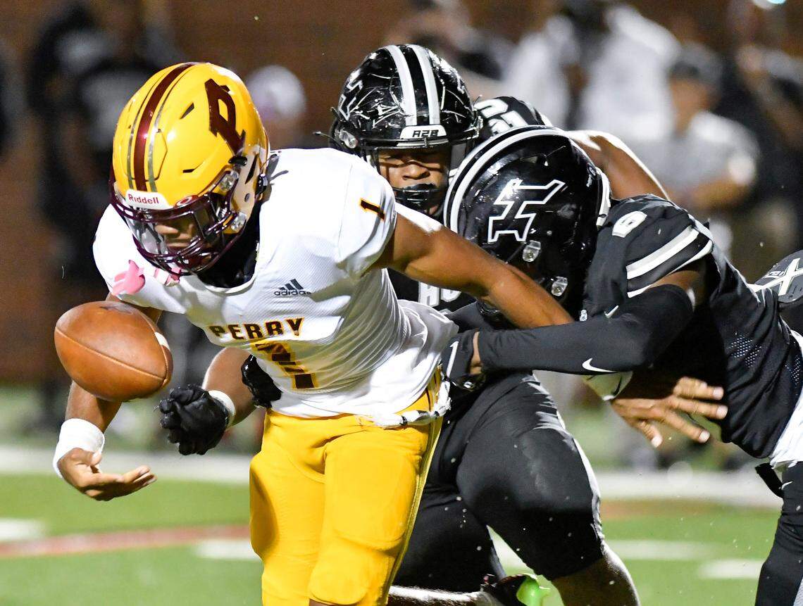 Perry quarterback Armar Gordon, Jr. (1) fumbles the ball during the Panthers’ 57-56 loss to Houston County Friday night.