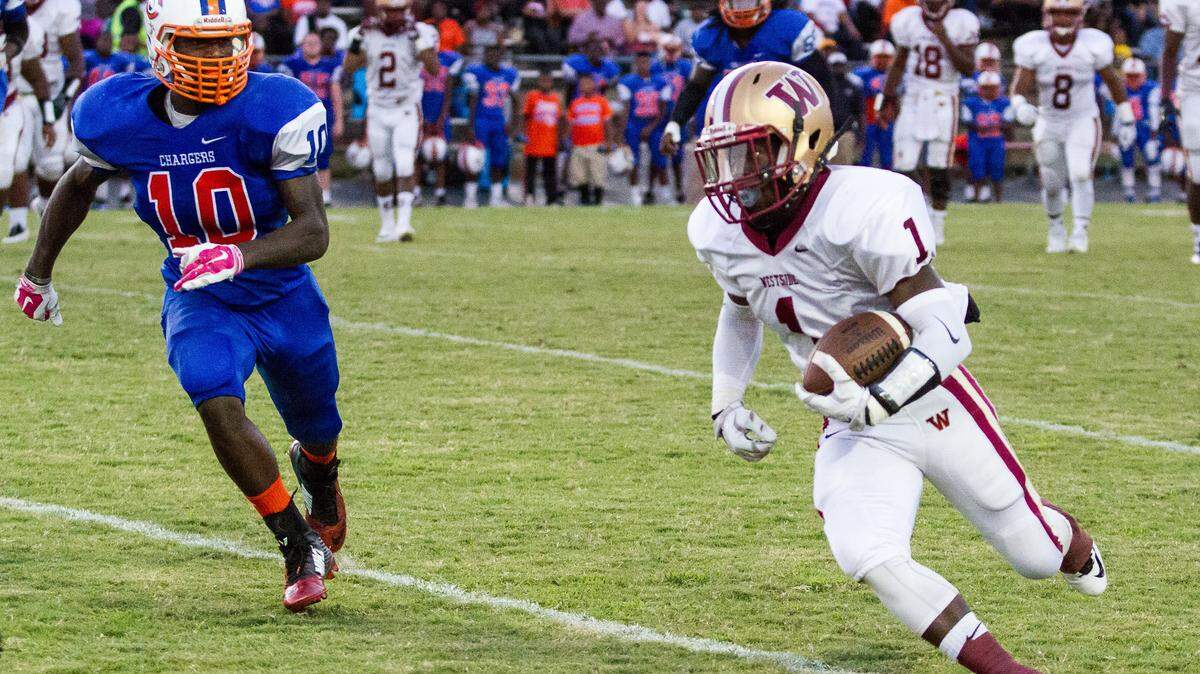 CLAY TEAGUE/FOR THE TELEGRAPH 
 Macon, GA, 9/18/15 
 Westside's Gerimie Mitchell gaining yardage in the 1st half of their 2-AAA matchup Friday night against Central.