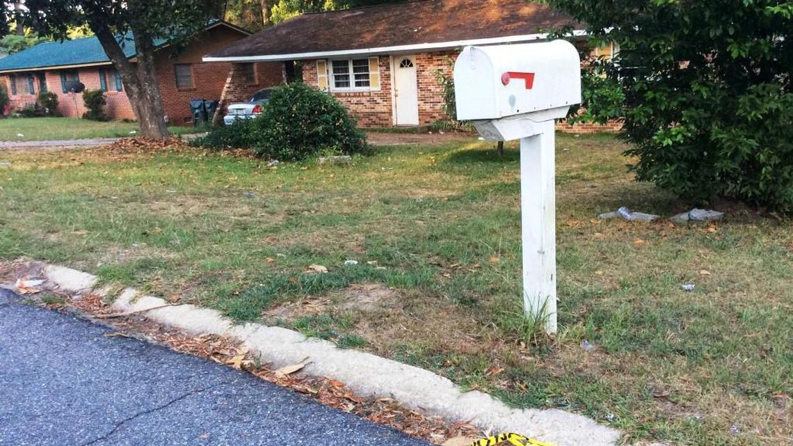 Crime scene tape litters the 100 block of Magnolia Avenue in Warner Robins where five people were shot late Wednesday night.