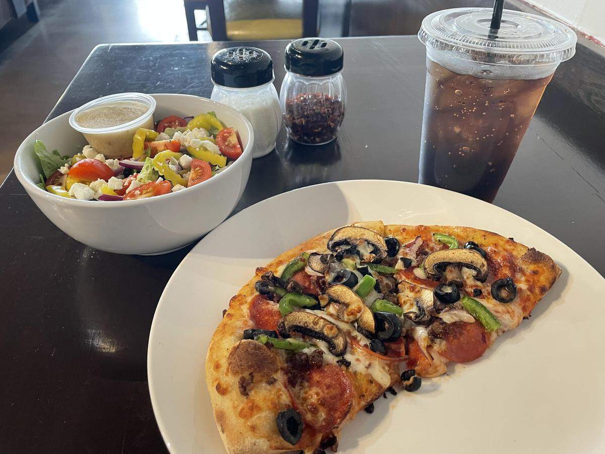 A “pick two” of half of a 10-inch signature supreme pizza, Greek salad and a fountain drink at the new Aria Pizza in Warner Robins.