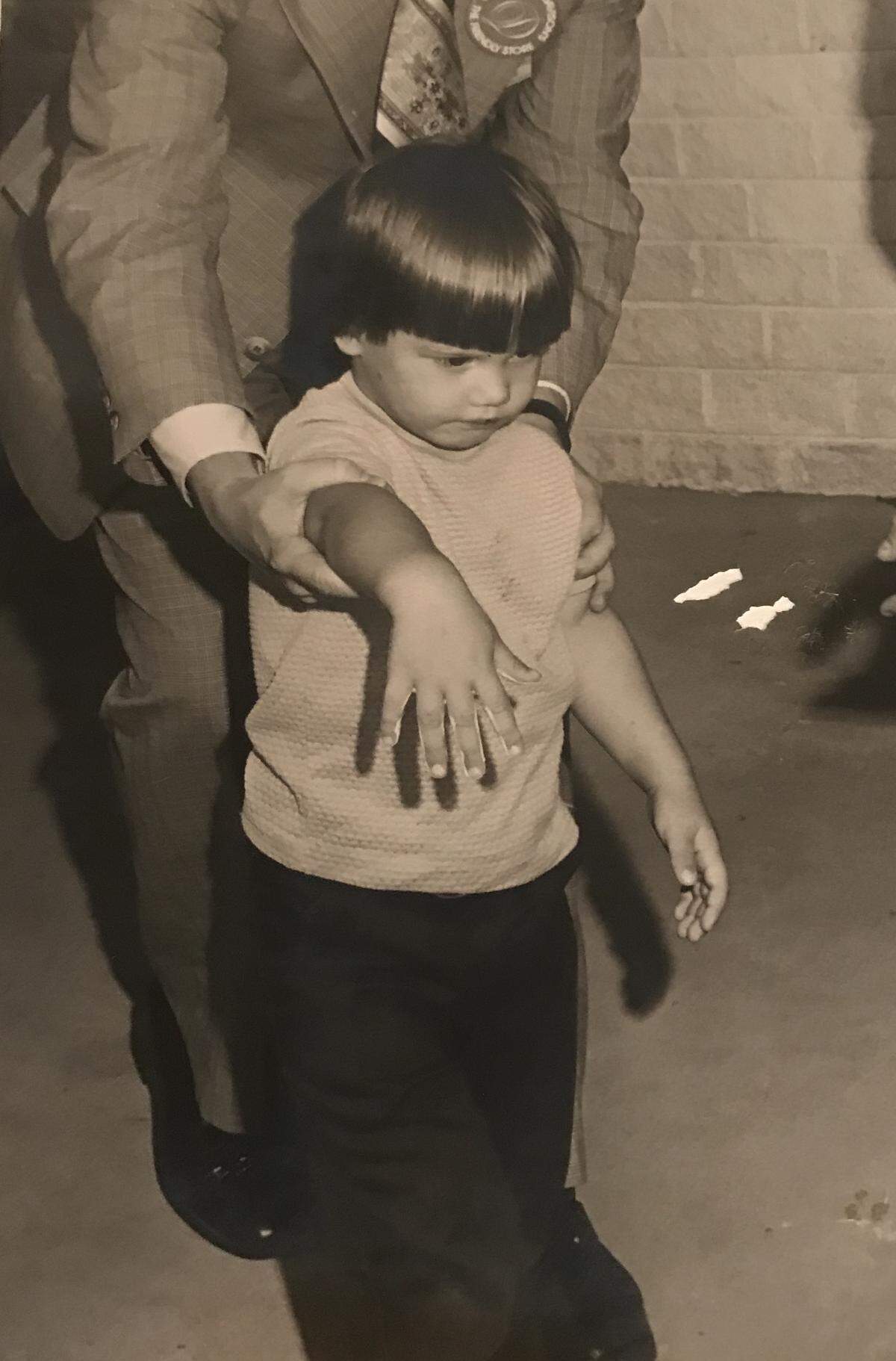 Photo of Grant Hendrickson getting ready to make his handprint.