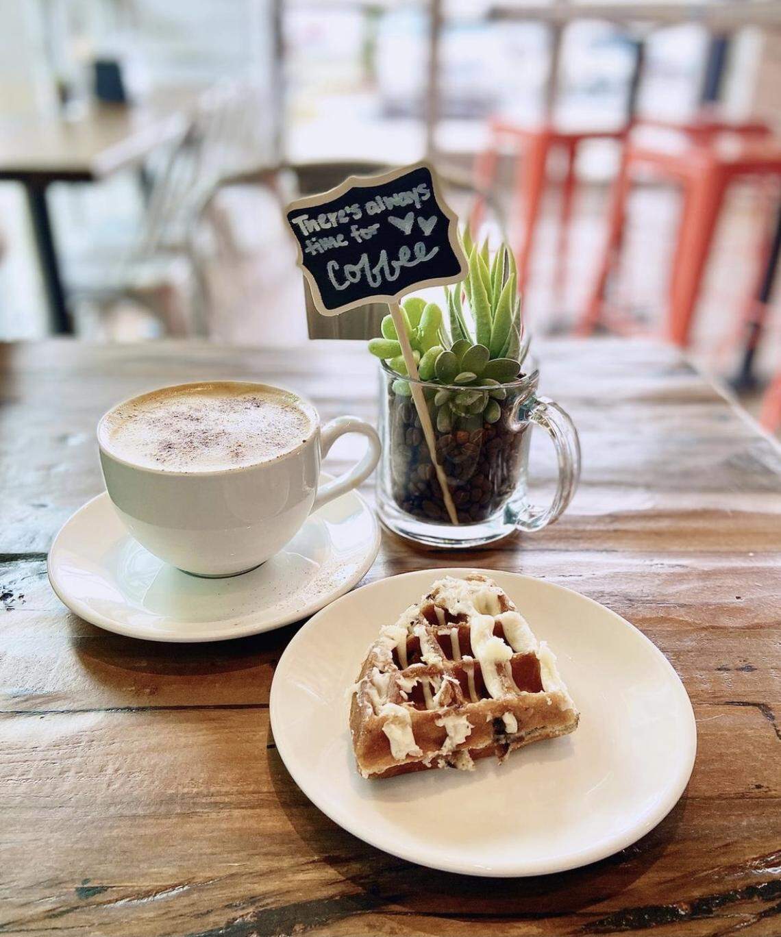 A latte and a scone from Just Love Coffee Cafe.