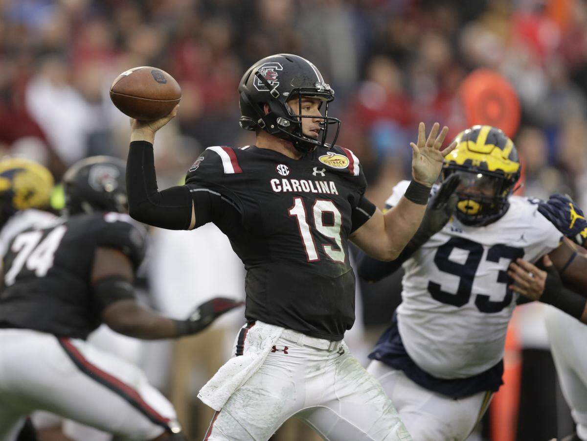 South Carolina quarterback Jake Bentley throws a pass against Michigan during the second half of the Outback Bowl.
