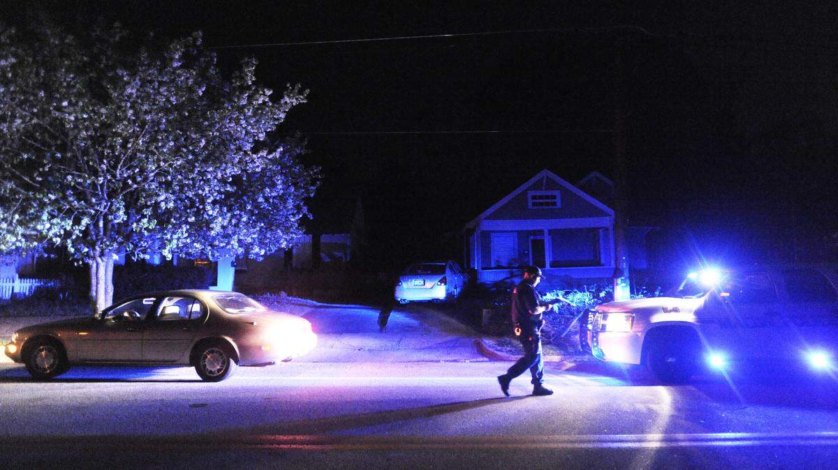 GRANT BLANKENSHIP/THE TELEGRAPH 
 Macon Police Officer Matt Tout walks back to his vehicle after writing a warning to a driver who breezed through the stop sign at Ingleside Avenue and Ridge Avenue while on a regular off duty patrol of the neighborhood in 2010. Tout and another officer were paid by neighborhood residents to patrol a section of the Ingleside area while off duty.