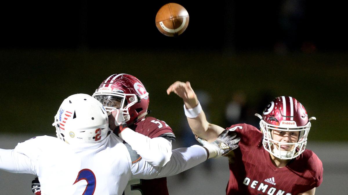 Warner Robins quarterback Dylan Fromm (6) throws a pass over the middle of the field during the first half of the Demons’ November game against Veterans in this Telegraph file photo.
