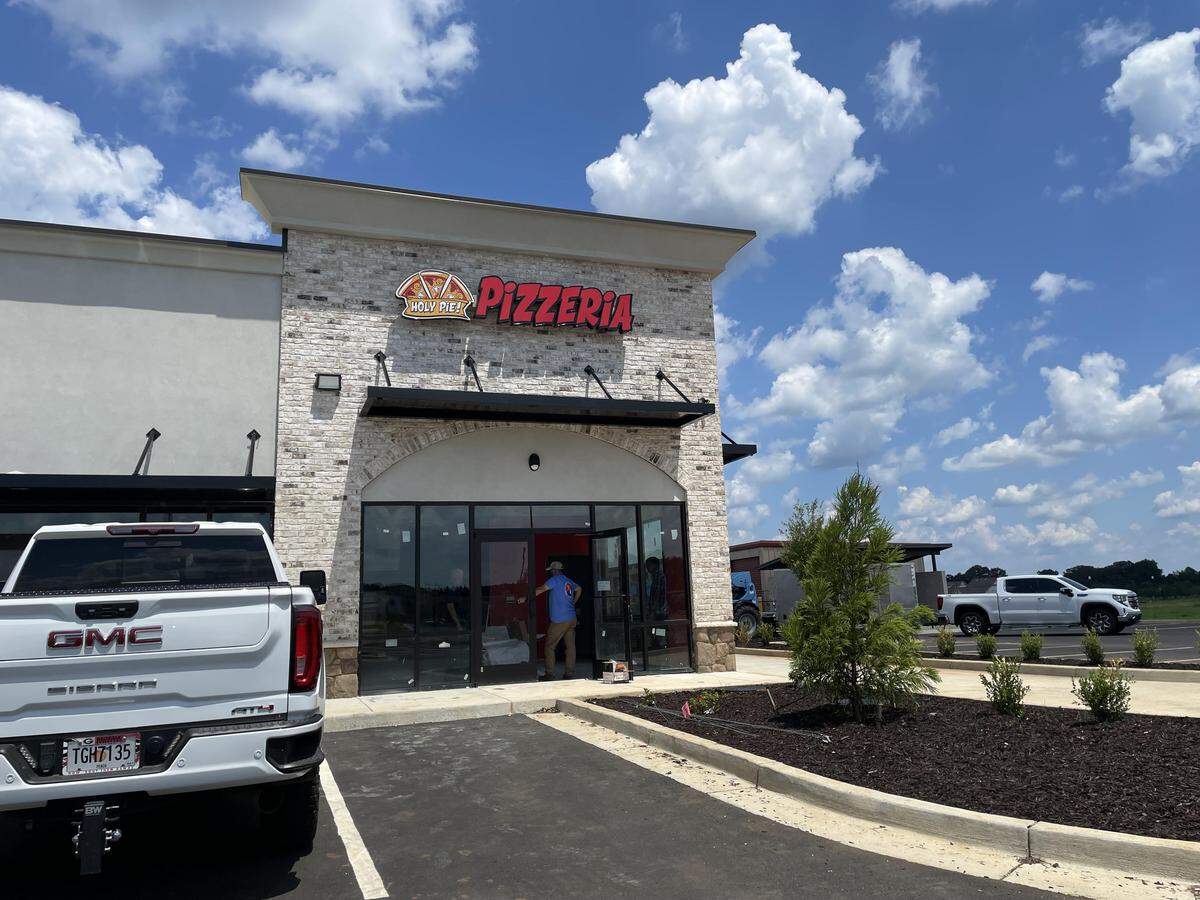 The Holy Pie! Pizzeria sign is up in a new shopping center in Perry in proximity to a proposed new Kroger Marketplace and commercial shopping center site. The new pie place will have a drive-thru.