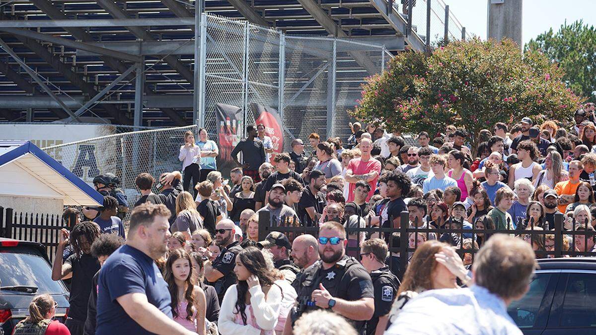 Students wait to be picked up by their parents after a shooting at Apalachee High School in Winder, Ga., on Wednesday, Sept. 4, 2024. A 14-year-old boy was in custody after two students and two teachers were killed and nine others wounded, authorities said.