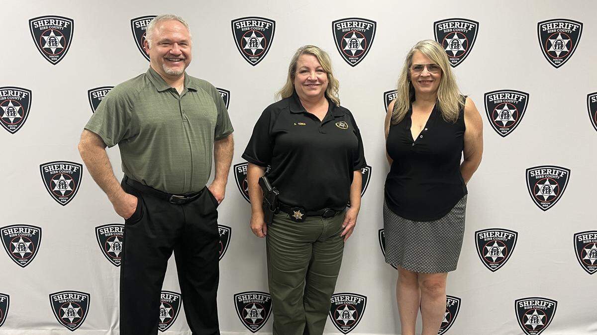 (left to right) Jay Eisner, Inv. Kristina Tench and Amy Christine Hutsell pose at the Bibb County Sheriff’s Office on Aug. 29, 2025. They discussed a recent partnership between the sheriff’s office and the Georgia Criminal Justice Coordinating Council to investigate local cold homicide cases.