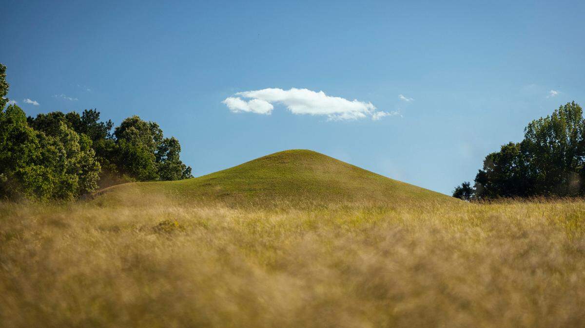 The Earth Lodge, dated to 1015 AD, was built by the Mississippian culture and later restored from archaeological evidence and is part of Ocmulgee Mounds National Historical Park.