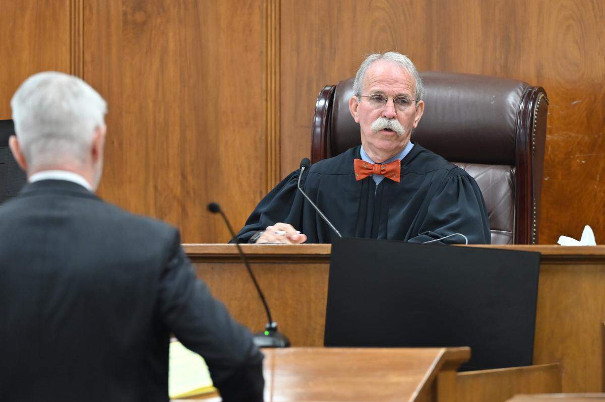Ogeechee Judicial Circuit Judge F. Gates Peed (right) speaks to attorneys during the bond hearing for Kevin Bradley on Friday, May 8, 2026, at the Bibb County Superior Courthouse in Macon, Ga. Peed denied bond for Bradley, a Macon attorney who is accused of dropping off an envelope containing synthetic marijuana to an incarcerated man at the Bibb County Jail.