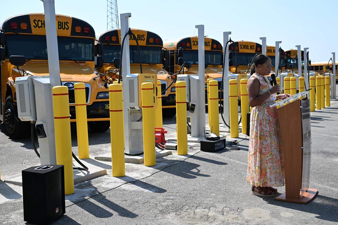 Mothers & Others For Clean Air healthcare champion Keisha Renee Collins speaks on the benefits of electric vehicles during an unveiling of the new Bibb County School District electric school bus fleet on Thursday, April 23, 2026, in Macon, Ga. MCSD unveiled its first all-electric school bus fleet with 15 buses and chargers.