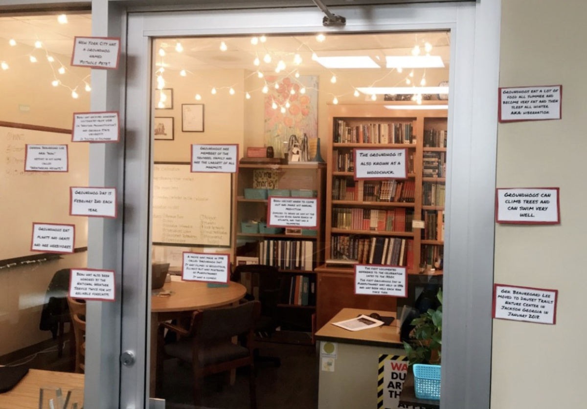 Morley Conn posts facts about Groundhog Day outside her office at Stratford Academy.