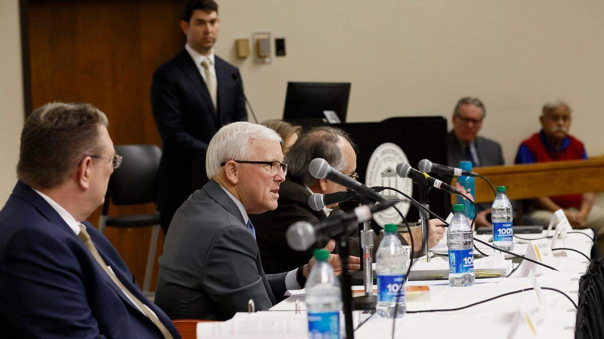 Chairman William S. Duffey Jr., center, speaks in Macon Feb 7. Duffey a retired federal judge who has been leading Georgia’s State Election Board during a time when it debunked false claims of 2020 election fraud is stepping down effective Friday.