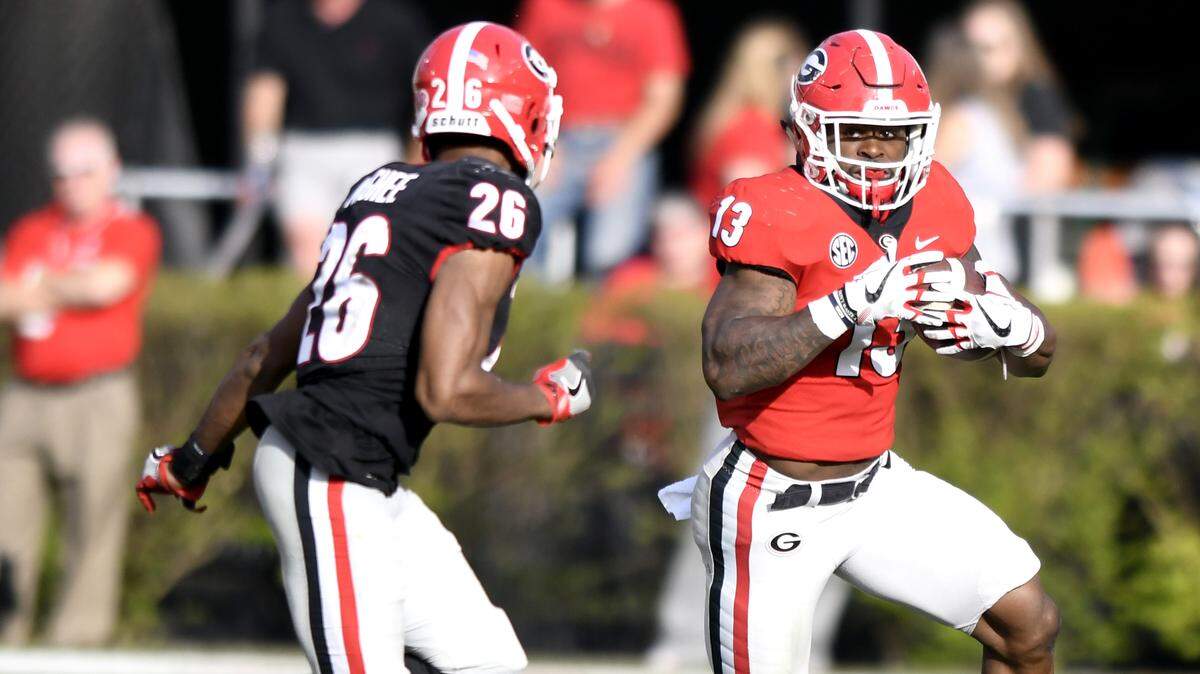 Georgia running back Elijah Holyfield (13) carries the ball at G-Day.