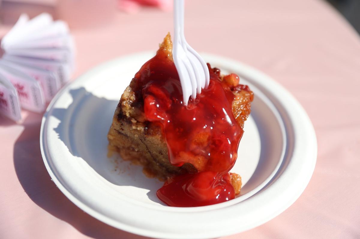 Cherry Bread Pudding from Parish on Cherry sits on a table during the Pink Provisions Trail preview on Friday, March 21, 2025, in downtown Macon, Georgia. Local Macon restaurants and bars debuted pink bites and drinks to celebrate the International Cherry Blossom Festival, all of which are available throughout the festival.