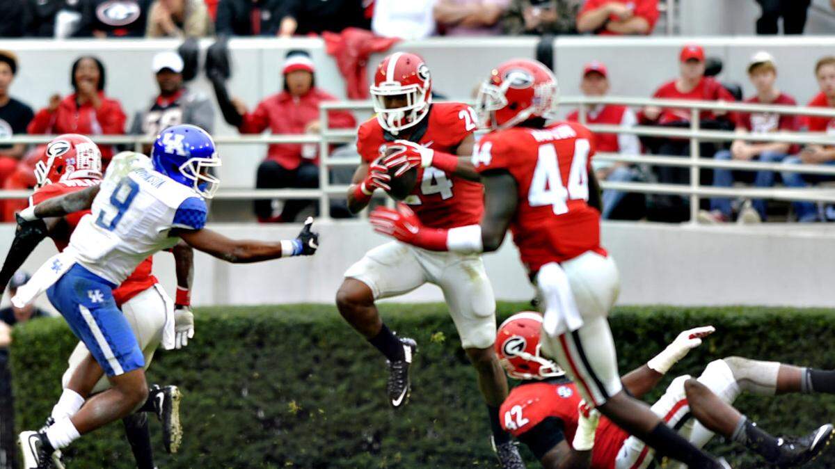 Georgia's Dominick Sanders (24) intercepts a Patrick Towles pass and returned it 24 yards in the fourth quarter Saturday.