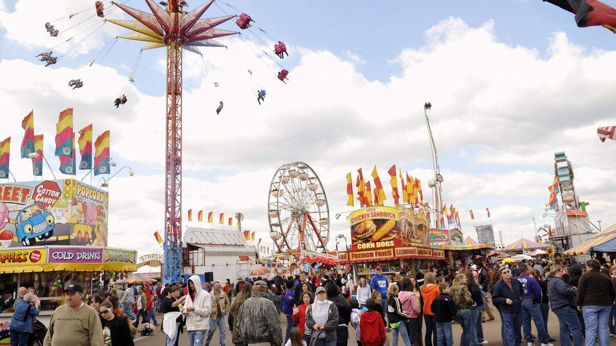 Visitors crowd the midway at the Georgia National Fair.