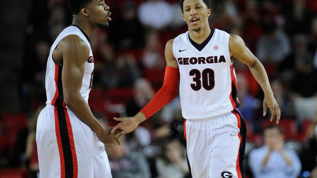 Georgia guards Kenny Gaines (12) and J.J. Frazier (30) react on the court during the second half of their 70-63 win over Alabama in an NCAA college basketball game, Saturday, March 5, 2016, in Athens, Ga. (AJ Reynolds/Athens Banner-Herald via AP) MAGS OUT; MANDATORY CREDIT