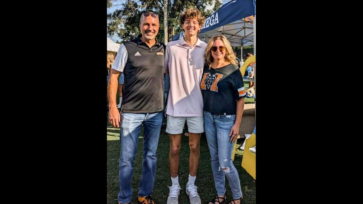 Mason Sells poses for a photo with his family. Sells died in September after suddenly collapsing during an intramural soccer match.