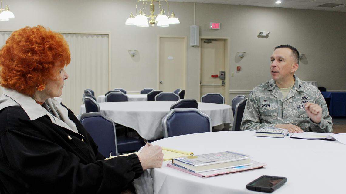 Col. Lyle Drew, commander of the 78th Air Base Wing at Robins Air Force Base, talks to Jo Drinkhahn at his recent book club meeting.