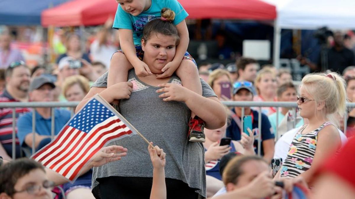 Getting a good seat at the Independence Day concert Friday in Warner Robins may not have been easy for some of the 5,000 or so music fans but for Hunter Scott, 7, it was easy. He found a good perch atop his sister Venus' shoulders.