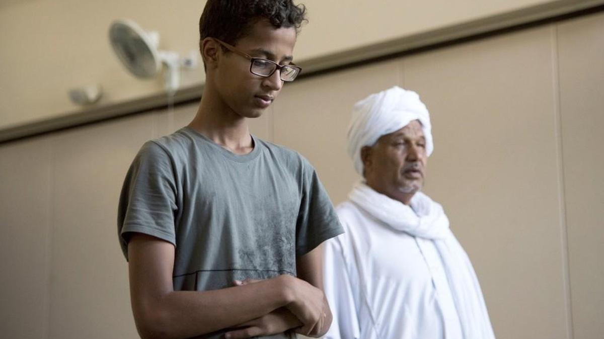 Ahmed Mohamed and his father pray at the Islamic Center of Irving in Irving, Texas. After moving to Qatar for nine months, Ahmed is home in Texas for the summer.