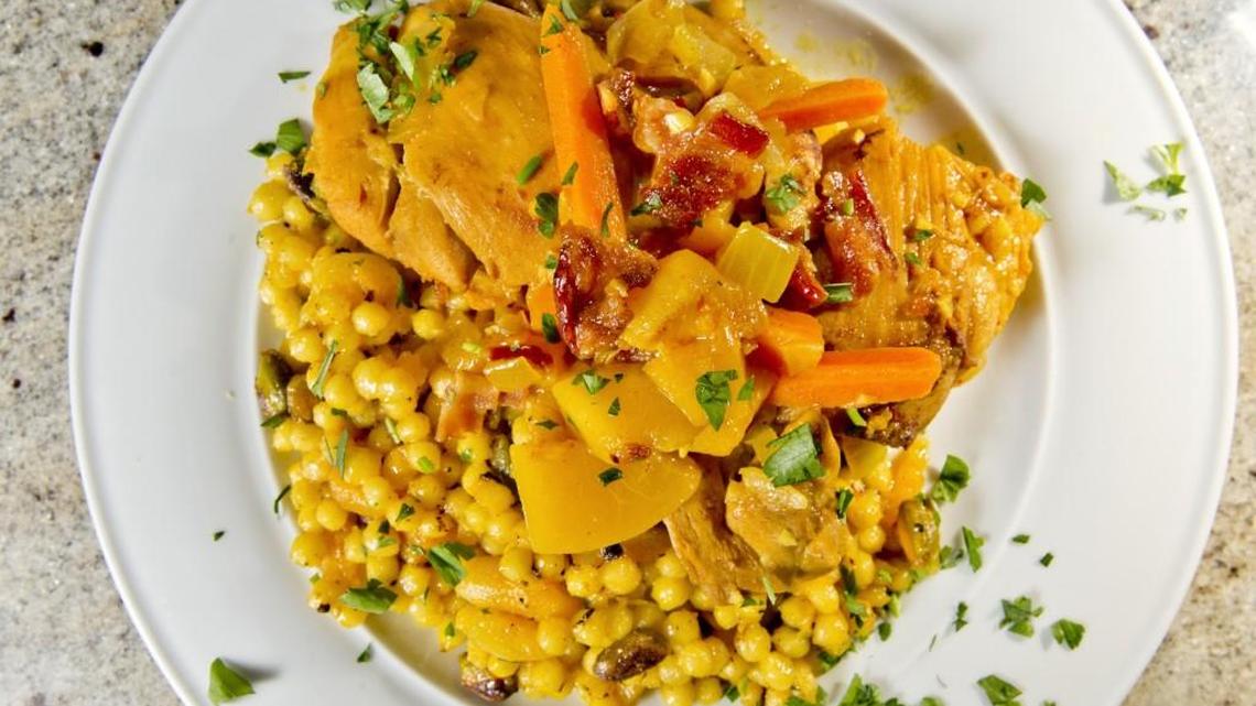 Peachy Chicken Tagine combines the flavors of apple wood-smoked bacon, garlic, peaches and lots of warm spices. It’s served over Saffron Pearl Cous Cous.