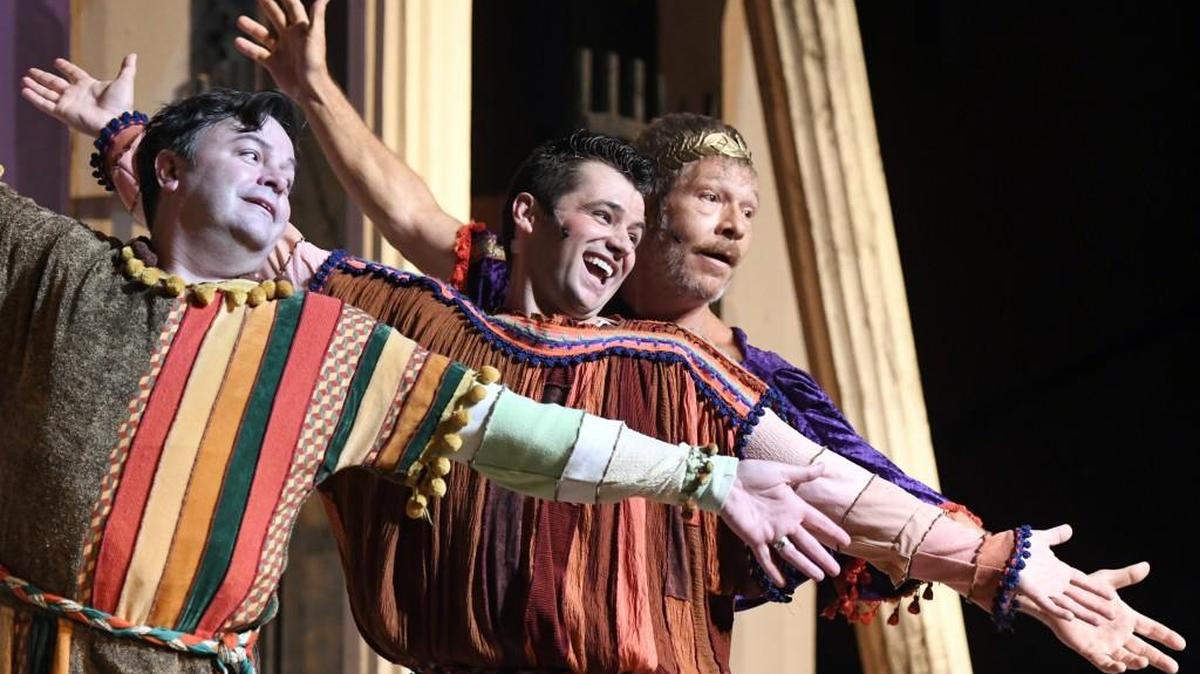 From left, Chris Abbott, Tim Hinojosa and Todd Wilson rehearse a song from Theatre Macon’s production of “A Funny Thing Happened on the Way to the Forum.”